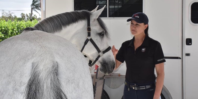 Adrienne Lyle petting horse